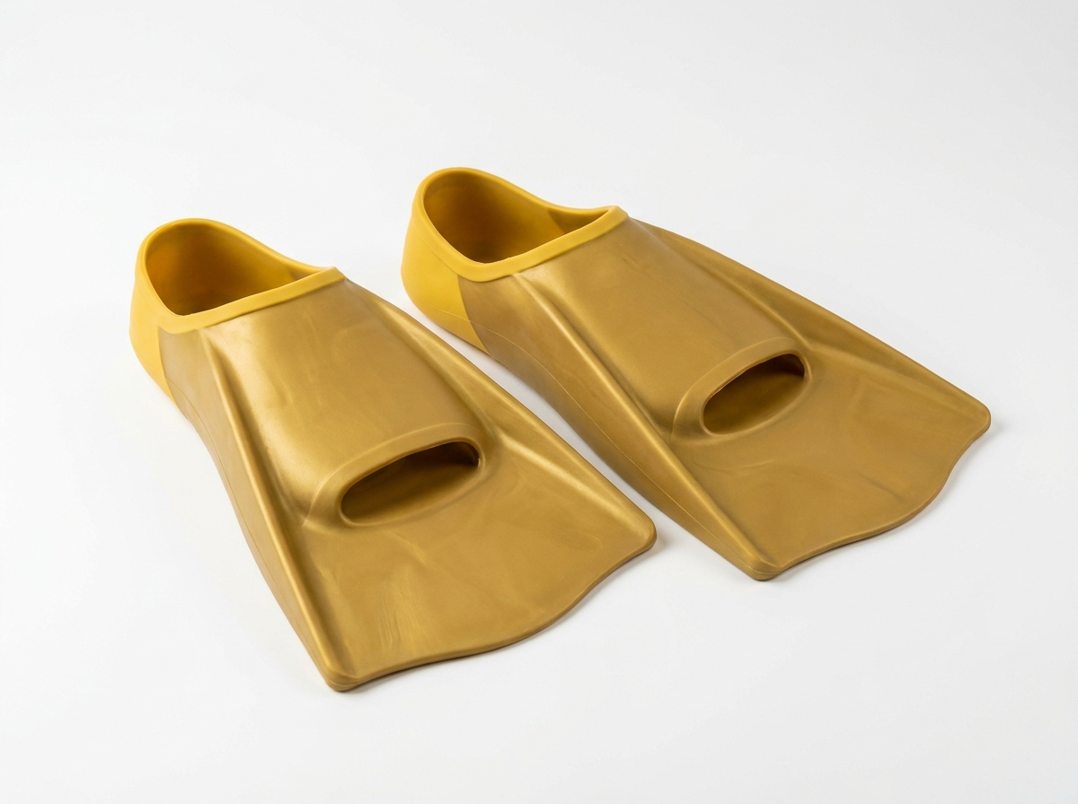 Finis Zoomers Gold training fins — short compact fins in gold and yellow for swim technique training